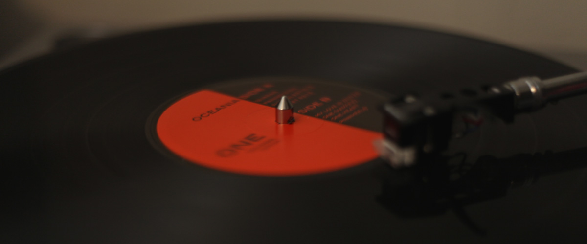 A vinyl copy of Oceania, playing, label slightly blurred